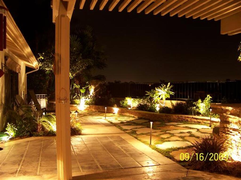 Illuminated garden pathway with custom seating area